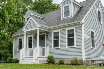 How often should you soft wash a painted wood exterior to prevent peeling?