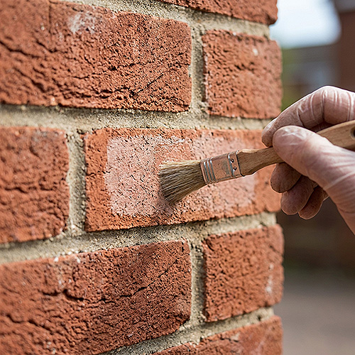 Should you test a brick cleaner before using it on the whole surface?